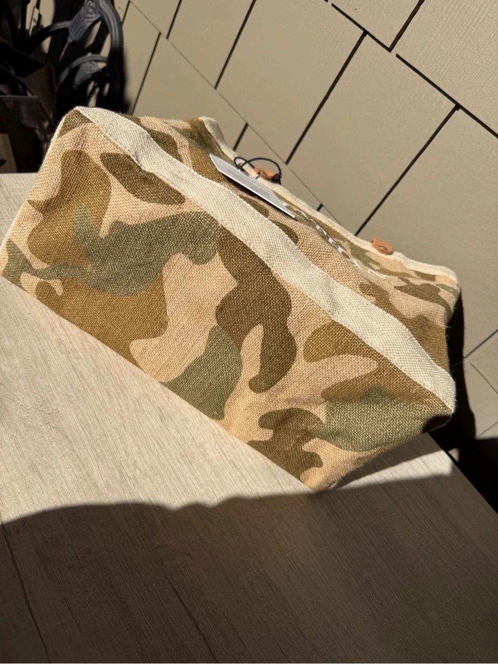 Apolis Global Citizen Market Bag in a safari camo print with tan leather handles